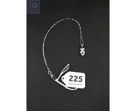 9 CARAT WHITE GOLD AQUA MARINE PENDANT ON 14 CARAT WHITE GOLD CHAIN 