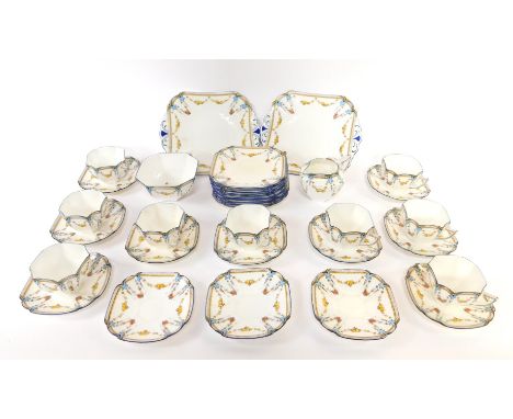 An early 20thC Shelley porcelain part tea service, decorated with swags of fruit, no.11705D, printed and painted marks, compr