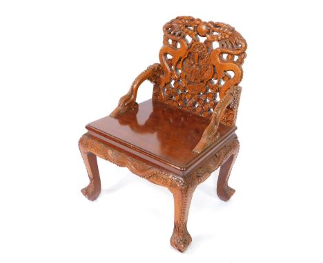 A Chinese carved hardwood dragon armchair, the back with two dragons and a flaming pearl, central panel with figures, above c