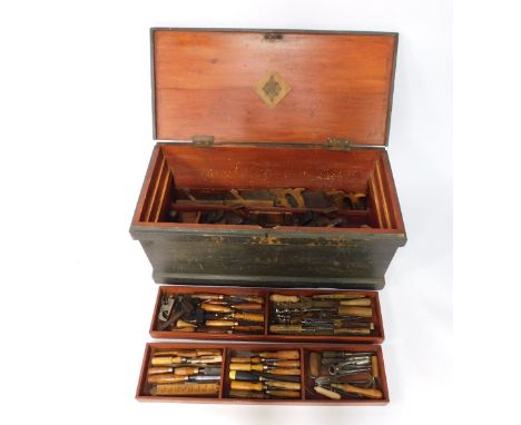 A carpenter's pine tool chest, containing an assortment of chisels, planes, braces, and other tools, chest 46cm H, 100cm W, 4