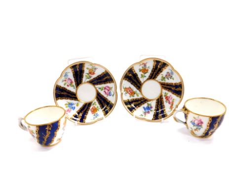A pair of late 18thC Sevres coffee cups and saucers, of ogee form, decorated with reserves of flowers, and foliate gilding, a
