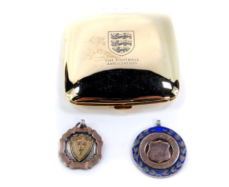 A George V silver gilt and enamel football medallion, P-Boro &amp; Dist Thursday Challenge Cup, Winners 1923-4, further silve