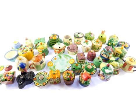 A collection of Marutomo ware and other Japanese ceramic preserve jars and covers, honey pots and a pair of candlesticks, etc
