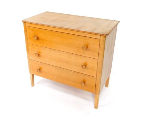 A Gordon Russell 1950's walnut and beech chest of drawers, with three drawers raised on tapering square legs, bears Russell o