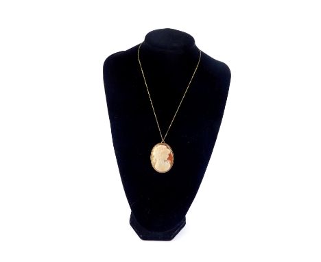 A 9ct gold and shell cameo brooch, bust portrait of a lady, with pendant mount, on a 9ct gold chain.