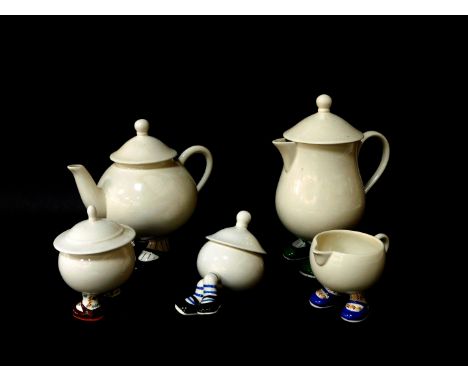 A Carltonware lustre pottery 'Walking' teapot, hot water jug, milk jug and two sugar basins with covers, one crossed legged. 