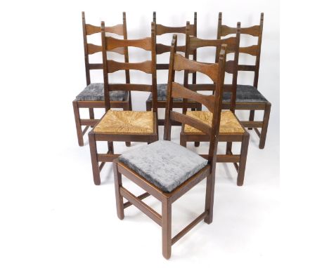 A set of six oak ladder back dining chairs, four with drop-in seats, two rush seated.