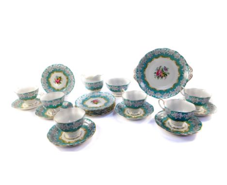 A Royal Albert porcelain part tea service decorated in the Enchantment pattern, comprising bread plate, cream jug, sugar bowl