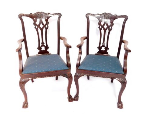 A set of eight early 20thC Chippendale style mahogany dining chairs, with leaf carved crest rail, and pierced slat, drop-in s