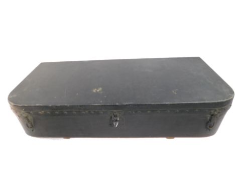 A Louis Vuitton early 20thC car trunk, possibly for a Rolls Royce, the studded black bow fronted case opening to reveal a fit