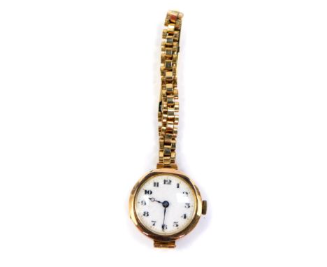 A Buren ladies 9ct gold circular cased wristwatch, white enamel dial bearing arabic numerals, fifteen jewel movement, on a pl