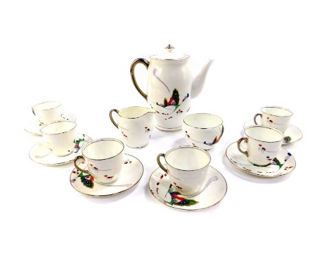 An Art Deco Atlas porcelain part coffee service, decorated with a stylised house and trees, comprising coffee pot, cream jug,