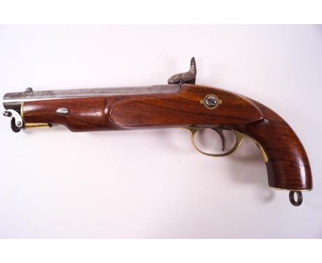 A reproduction percussion cap single barrel pistol, the hardwood stock with a brass set stock end, a similarly set trigger pi