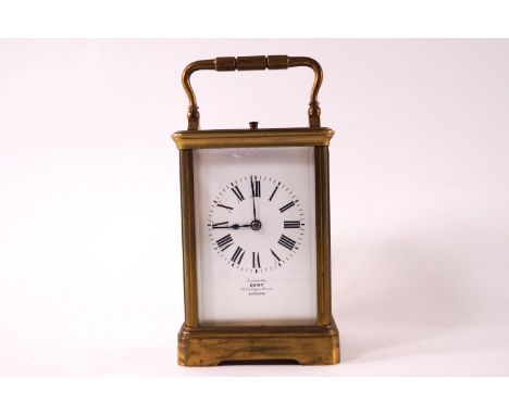 A brass cased repeater carriage clock with white enamel Roman chapter dial marked 'examined by Dent, 33 Cockspur Street, Lond