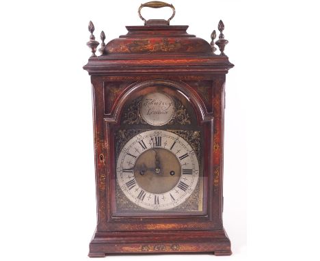 A red Japanned 18th century style bracket fusee clock with domed top set a strap handle and four flamiform finials, the case 