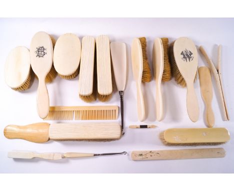 A mixed collection of 19th century and early 20th century ivory backed brushes together with three shoe horns, a comb, a page