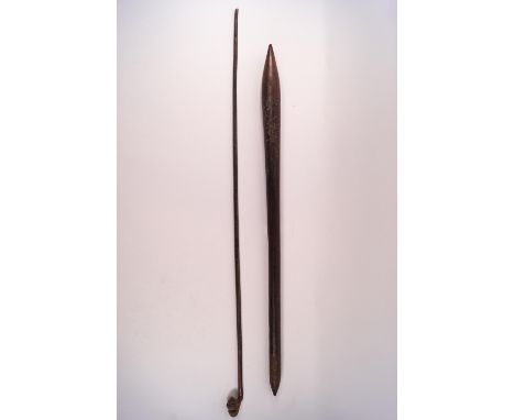 An African swagger stick the knop carved with a head, 80cm long together with a tapering pointed club, 71cm long