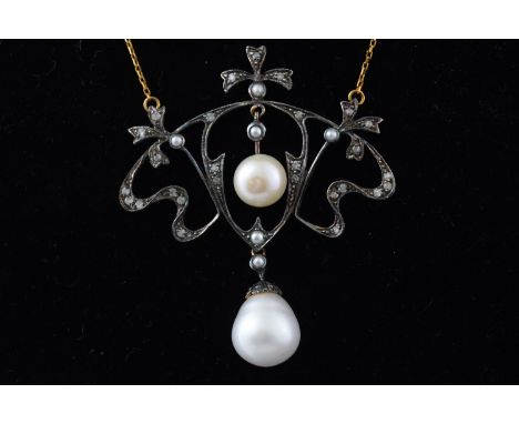 A yellow and white metal centrepiece pendant of scroll design having two freshwater cultured pearls and further set with seed