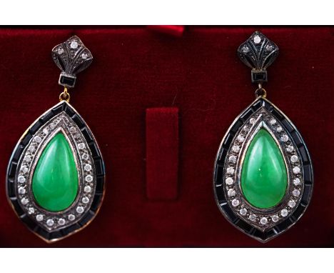 A yellow and white metal pair of drop earrings each set with a pear shape cabochon jadeite surrounded by round brilliant cut 