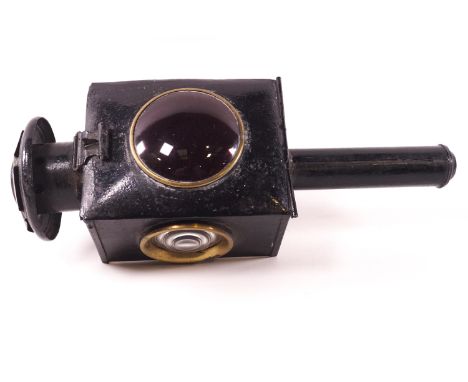 An early 20th century carriage lamp for the near side, black Japanned finish, the funnel finished as a floral motif, set with