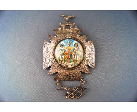 An Order of Foresters breast star set with the crest of a Stag's head in a ducal coronet, the main body engraved with Rococo 