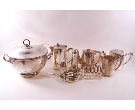 Eleven pieces of electroplate Hotel ware, comprising a lidded, two handled hemispherical soup tureen, 25cm high with ladle, a