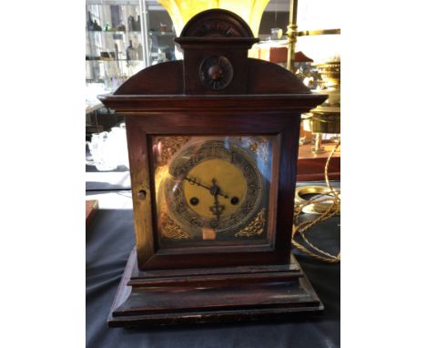 A mahogany framed mantel clock with silver and brass face. Height 40cm.