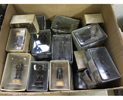 Two boxes of Lord of the Rings chess pieces with magazines.
