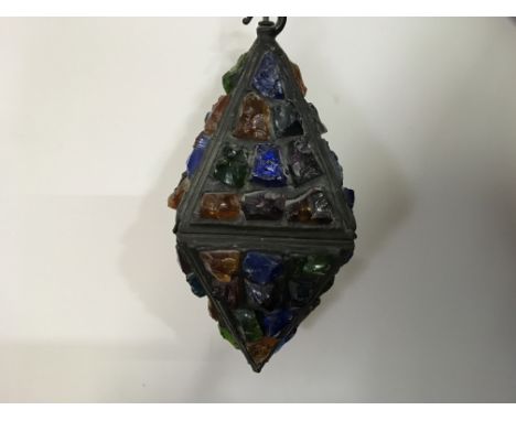 A diamond shaped lamp with Stourbridge glass in lead casing.
