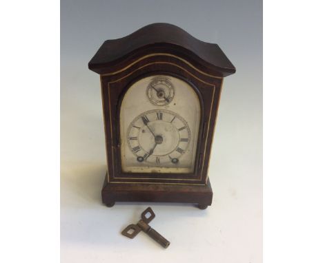 A walnut cased silver fronted mantel clock. 17cm x 11cm.