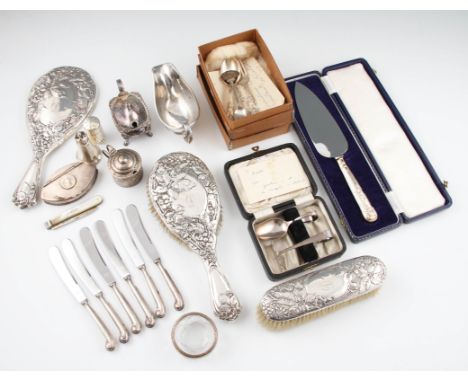 A collection of hallmarked silverware to include a silver rimmed glass trinket bowl, two pepperettes, a boxed spoon and pushe