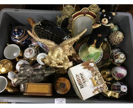 Two plastic boxes containing decorative mini teapots, egg shaped trinket boxes, clockwork bear, frames, plated tea ware etc.