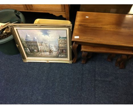 A reproduction mahogany nest of three tables, two plastic boxes containing two boys annuals, painting of street scene, study 
