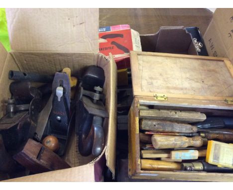 A collection of woodworking tools, including planes, chisels etc.