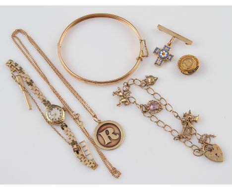 A collection of hallmarked 9ct yellow gold jewellery to include a curb link bracelet suspending five various charms and a hea