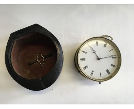 A brass VAP. Brevete travel clock in black leather case.