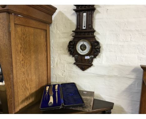 A wall mounting aneroide barometer with carved decoration (French).