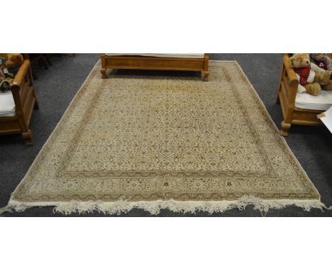 A Kaysari carpet in tones of cream 275cm x 205cm 