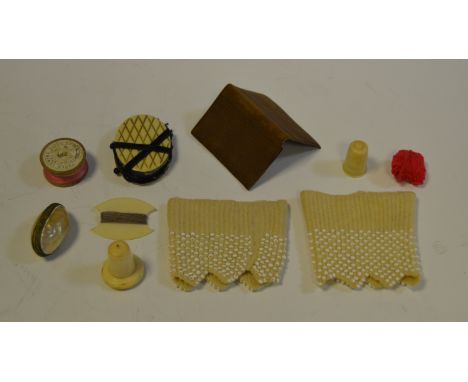 Sewing - a 19th century leather needle case; a pin cushion; a mother of pearl thimble case; etc