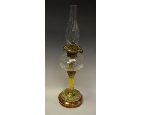 An Art Nouveau brass and copper oil lamp, clear glass reservoir, c.1905