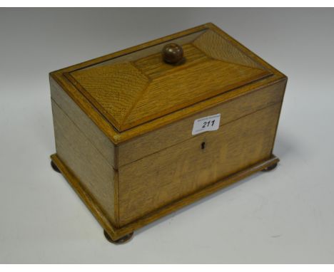 A Victorian oak sarcophagus tea caddy