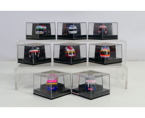 Onyx - A collection of Formula 1 drivers helmets including Rubens Barrichello, Nigel Mansell, Pedro Lamy, Alain Prost, Jos Ve