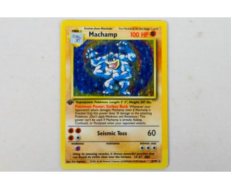 Pokemon - Trading Cards - A Pokemon Stage 2 Machamp holo card from a 1999 base set. This Card is a first edition and is in ex