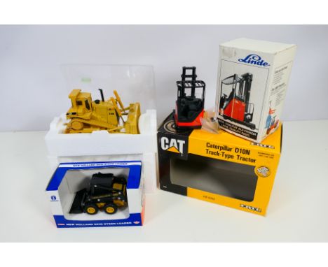 Conrad - Ertl - 3 x boxed construction vehicles, New Holland Skid Steer Loader in 1/32 scale # 358, a Cat D10N Track Type Tra