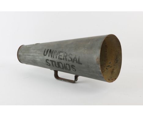 Universal Studios metal megaphone with original tag, 43 cm. Provenance: The vendor's father was given this when he worked for