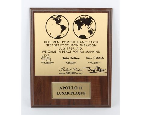 Buzz Aldrin  a gold and brown coloured souvenir plaque, being a replica of the one left on the moon by Apollo 11 in 1969, wit