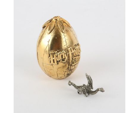 Harry Potter and the Goblet of Fire (2005) a golden Triwizard tournament egg with pewter Chinese Fireball dragon, promotional