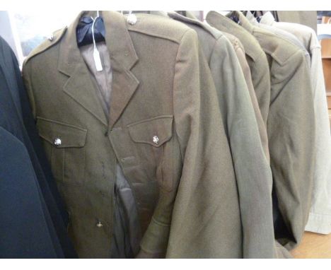 Various British army uniforms, box of caps, a US Navy mess jacket and two vintage leather satchels