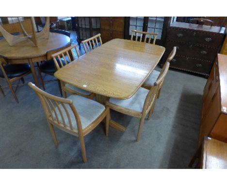 An Ercol dining table and six chairs