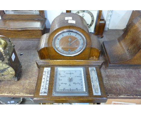 An oak mantel clock and aneroid barometer